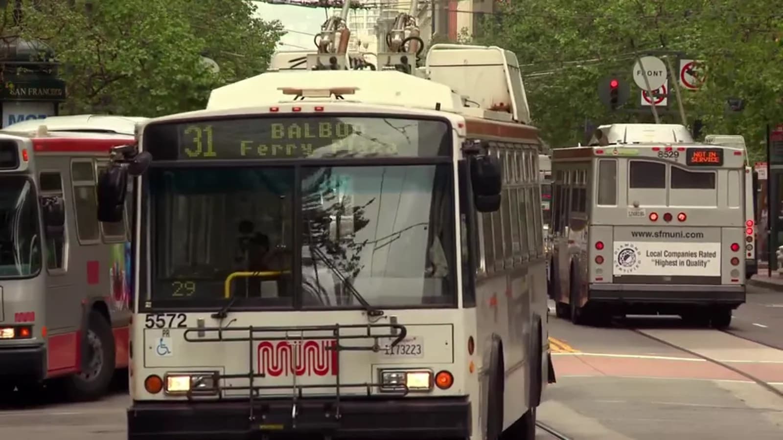 Street scene with several city buses